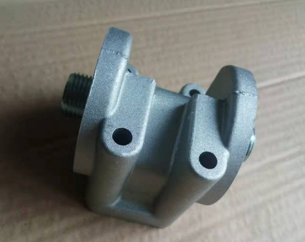 картинка Кронштейн масляного фильтра JX0818 WD615 ШАНКСИ, ШАКМАН, ДУЛАН VG1500070051 от магазина Dulan.tj